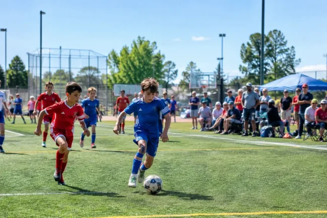 Youth sports participation shown by children practicing on a local community field